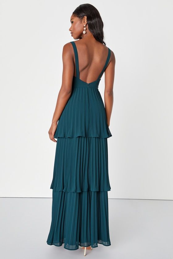 Get ready to have a maid of honor moment with the Lulus Luxe Perfection Emerald Green Pleated Tiered Backless Maxi Dress! Lightweight woven chiffon shapes this darling dress that has a sleeveless bodice with a stunning open back. Bustier-inspired bodice has gathered, seamed cups and a set-in waist. Skirt has a tiered, pleated design that falls to a maxi hem. Hidden zipper/clasp at back. Fit: This garment fits true to size. Length: Floor length. Size medium measures 54" from shoulder to hem. Bust Tiered Pleated Maxi Dress For Party, Sleeveless Evening Dress With Pleated Back For Bridesmaid, Bridesmaid Dresses With Sweetheart Neckline And Pleated Back, Backless Bridesmaid Dress With Ruched Bodice, Elegant Lined Dress For Bridesmaids, Elegant Tiered Dress For Date Night, Elegant Lined Bridesmaid Dress, Pleated Tiered Maxi Dress For Party, Formal Tiered Pleated Dresses