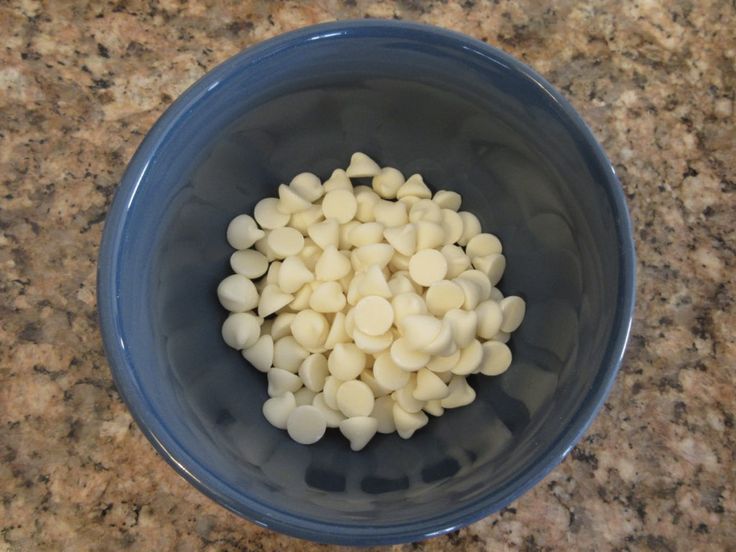 a blue bowl filled with white food on top of a counter