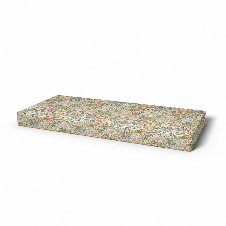 an image of a mattress that is made out of floral print fabric on a white background