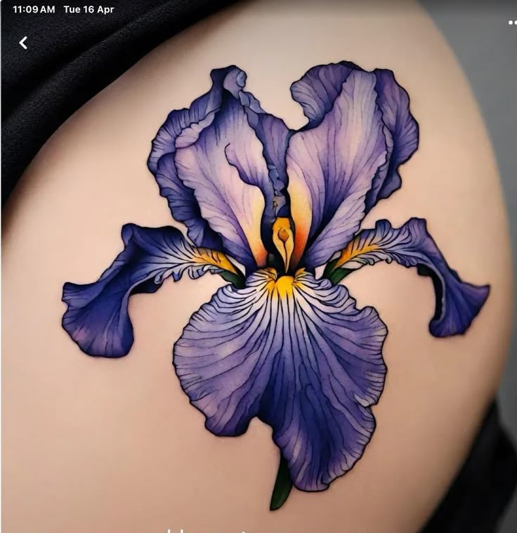 a woman's stomach with a tattoo of a purple flower on the lower side