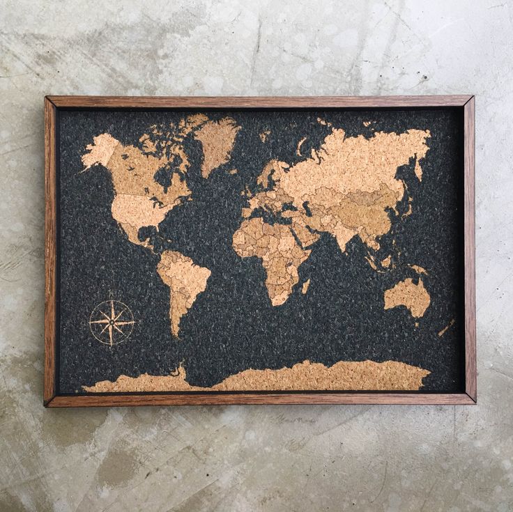 a cork board with a world map on it