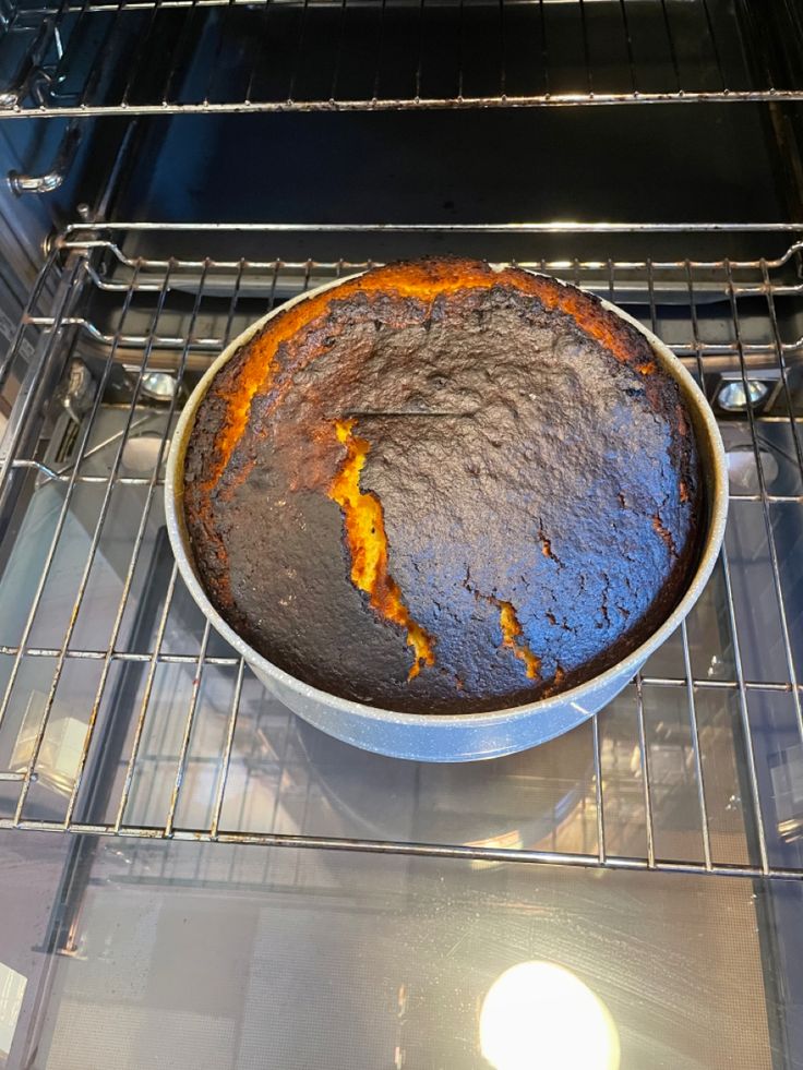 a cake sitting in an oven on top of a rack