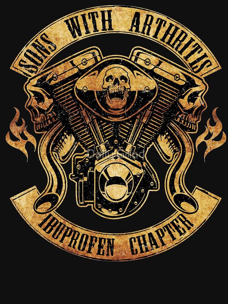 a black shirt with gold lettering and a skull on the front, riding a motorcycle