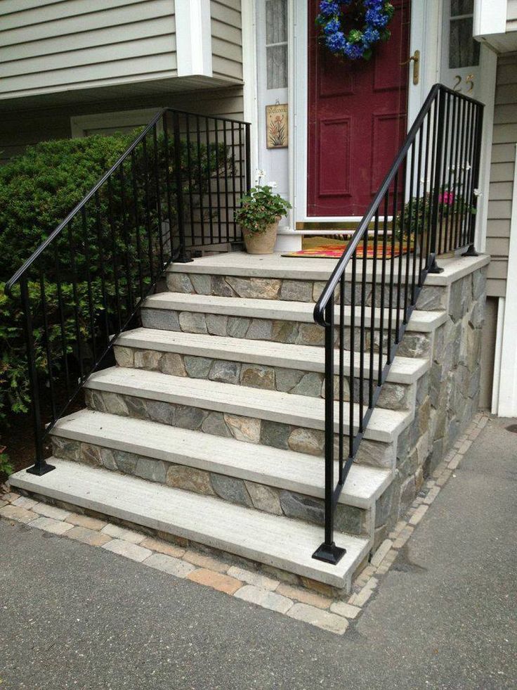 a set of stairs leading up to a red door