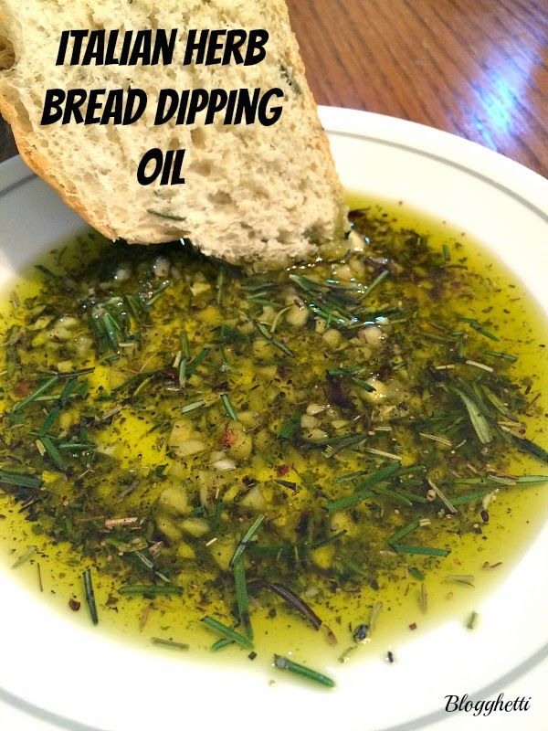 a white bowl filled with bread and olive oil