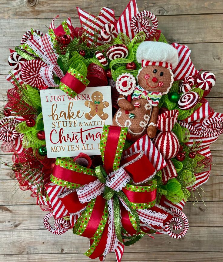 a christmas wreath with gingerbreads, candy canes and other decorations on it