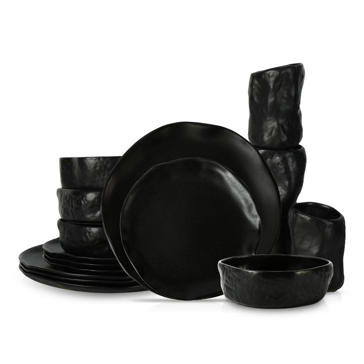 black dinnerware is stacked on top of each other