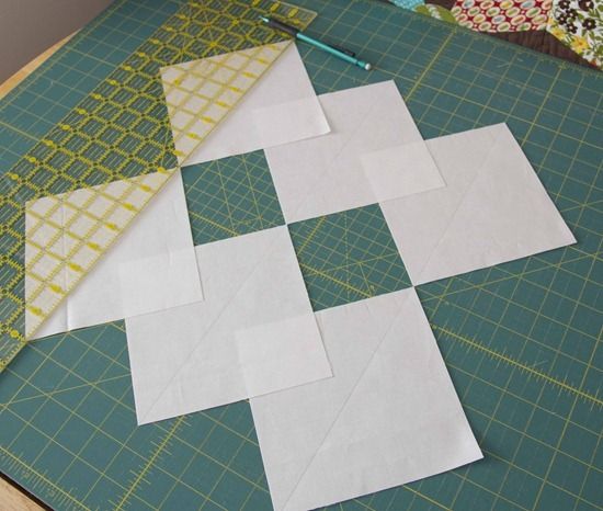 several pieces of paper are laid out on a cutting board