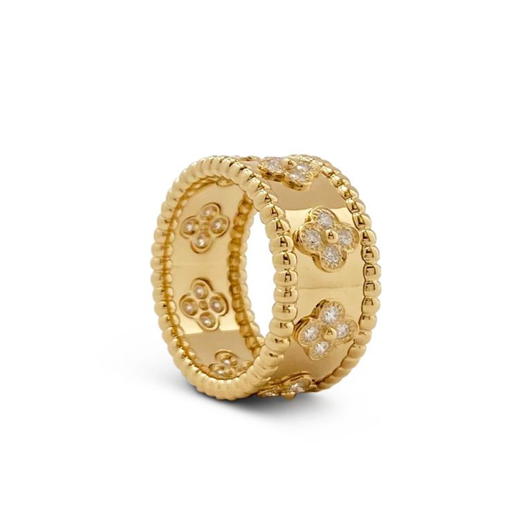 Authentic Van Cleef & Arpels Perlée Clovers ring crafted in 18 karat yellow gold. Adorned with clover motifs that are set with an estimated .71 carats of high quality (E-F color, VS clarity) round brilliant cut diamonds. Size 56, US 7.5. Signed VCA, AU750, 56, with serial number. Ring is presented with the original box and papers. CIRCA 2020sBrand: Van Cleef & ArpelsCollection: Perlée CloversMetal: 18K Yellow GoldGemstone: DiamondCondition: ExcellentWear: Consistent with age and useWeight: 10.9 Van Cleef Ring, Clover Rings, Van Cleef And Arpels Jewelry, Clover Ring, Authentic Vans, Van Cleef And Arpels, Ring Crafts, Van Cleef Arpels, Van Cleef