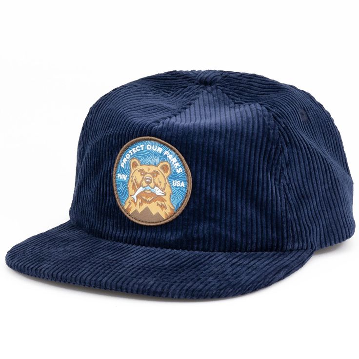 Take your look to the next level with our Protect Our Parks Bear Corduroy Cap. Crafted from premium 8 wale corduroy with an adjustable plastic clipback, this vintage inspired hat is made for durability and comfort, with recycled materials and an athletic soft sweatband. Add some vintage style to your wardrobe now! 8 wale corduroy Fabric: 100% Cotton Shape/ Profile: Lower Profile Closure: Clipback for maximum comfort Bill Shape: Flat Bill Bill made from recycled materials Coolmax athletic sweatba Casual Corduroy Hats For Outdoor, Adjustable Corduroy Hats For Outdoor, Casual Corduroy Trucker Hat With Flat Brim, Casual Corduroy Trucker Hat With Flat Bill, Casual Corduroy Snapback Hat For Streetwear, Adjustable Flat Bill Corduroy Hat, Casual Adjustable Corduroy Trucker Hat, Adjustable Corduroy Snapback Hat With Curved Brim, Adjustable Corduroy Trucker Hat With Flat Brim