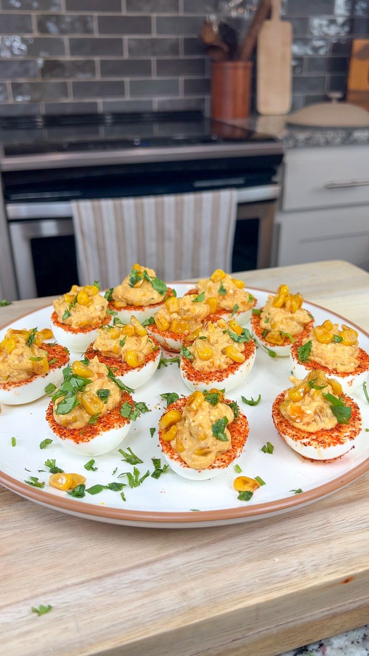 small appetizers are arranged on a plate in the middle of a kitchen counter