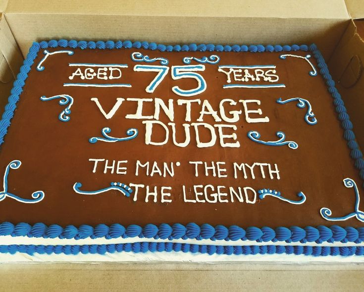 a brown and blue cake in a box with the words 75 years vintage dude on it