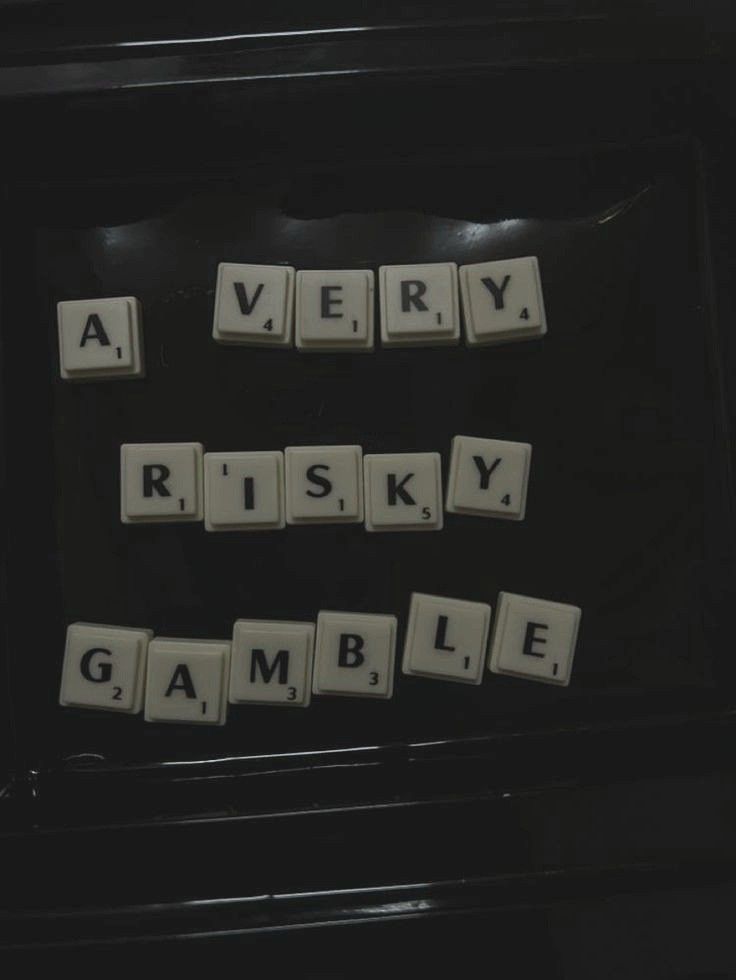 scrabble tiles spelling the words very, risky, game, gambling