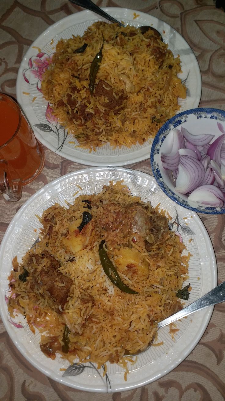 two plates filled with food on top of a table