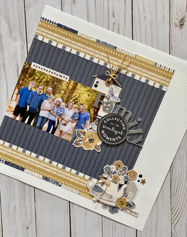 a scrapbook cover with an image of family and friends on it, sitting on a wooden surface