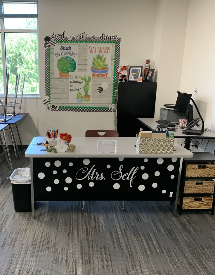 an office desk decorated with polka dots and the word mrs self on it's side