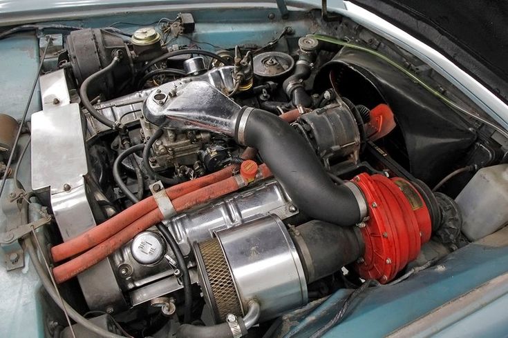 the engine compartment of an old blue car