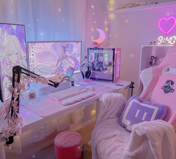 a desk with two computer monitors and a pink chair in front of the monitor screen