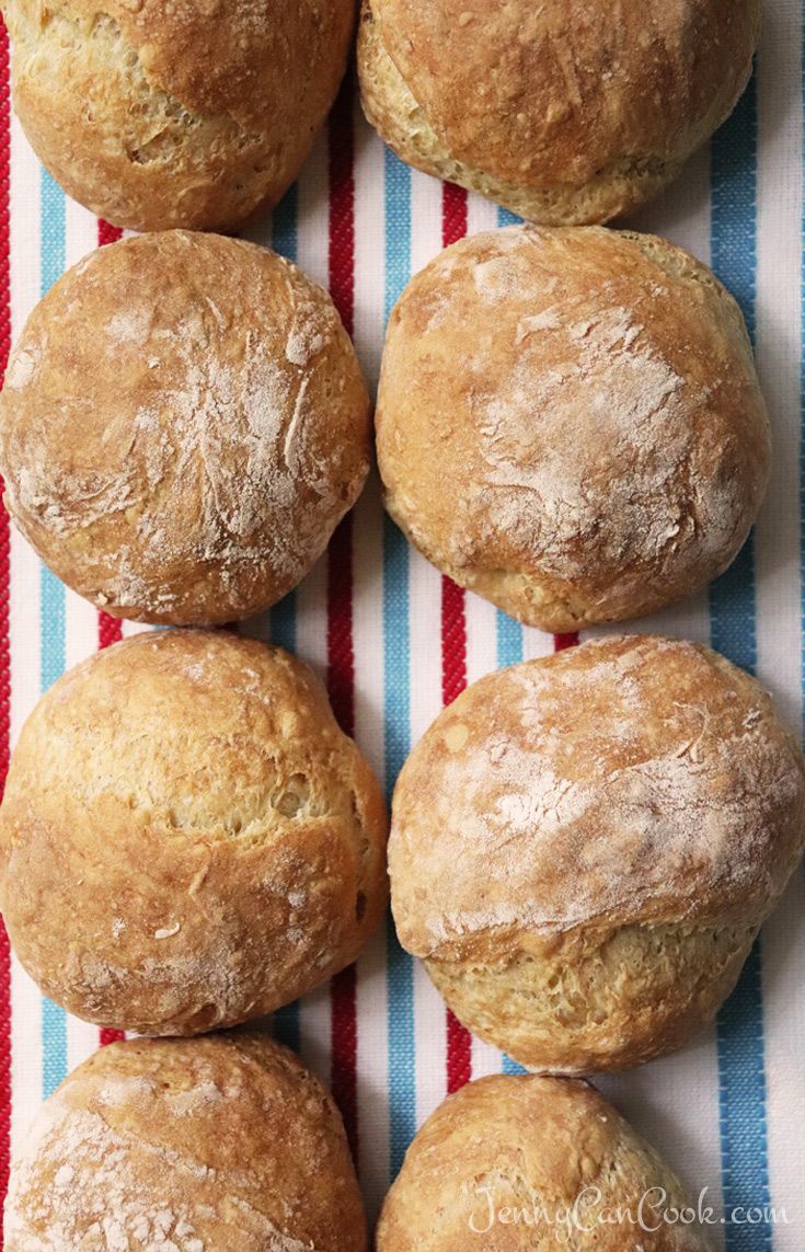 six muffins on a red and white striped cloth