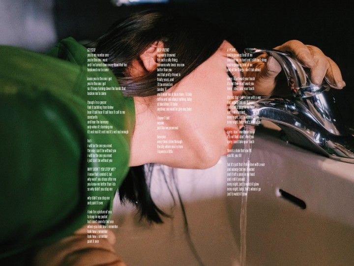 a woman drinking water from a faucet in a sink with the words on it