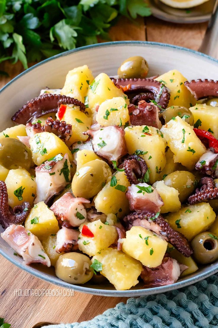 an octopus and pineapple salad in a bowl