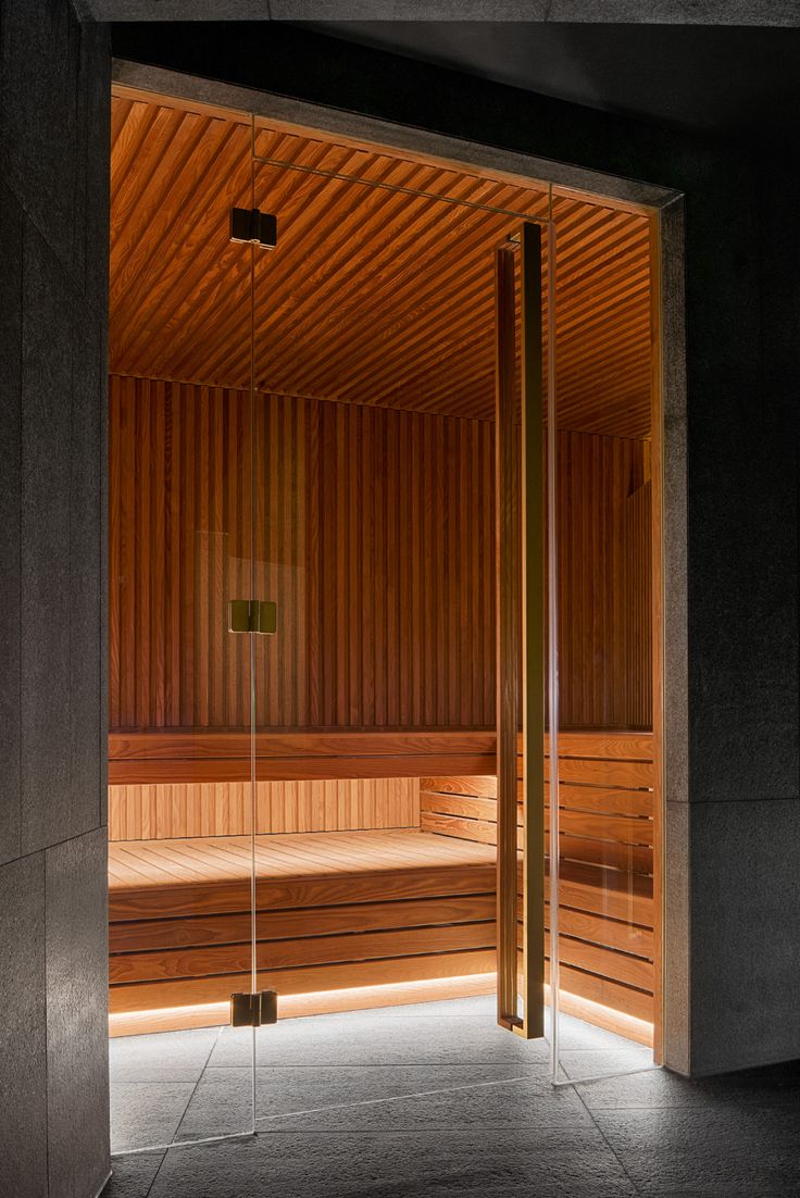 an indoor sauna is lit up at night