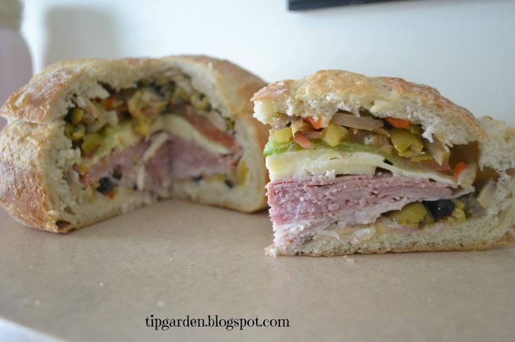 a cut in half sandwich sitting on top of a counter