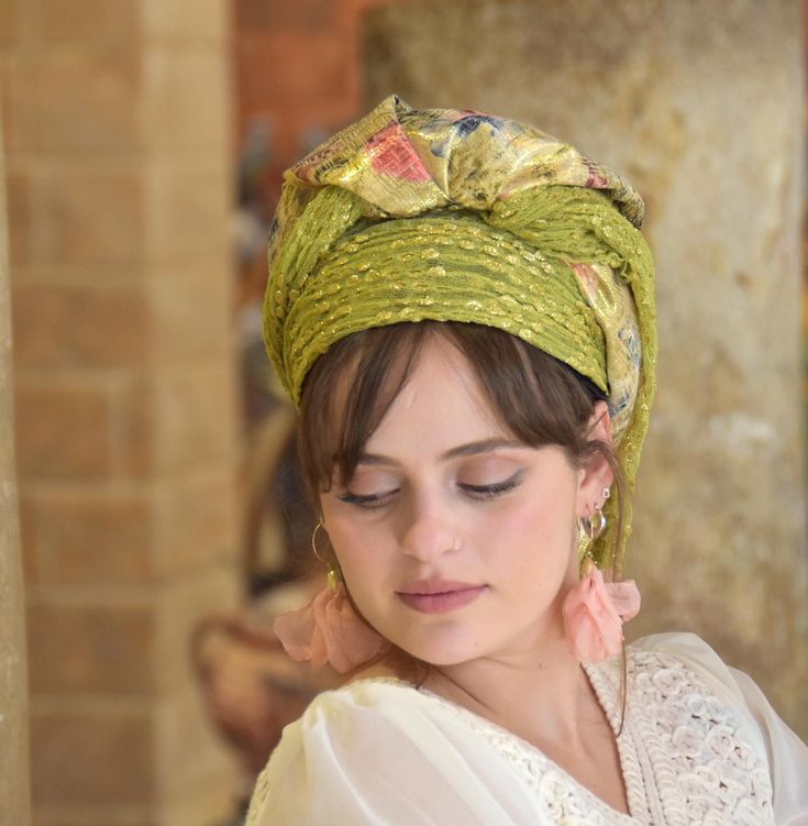 Premium Collection! A remarkable handmade headscarf or Tichel known as Mitpachat.  This stunning piece embodies both uniqueness and fashion.  It's a true work of art, featuring a beautiful Golden Floral Brocard fabric combined with a soft green gold lace fabric.  It is a large rectangle size: 200/50 cm. Not only does this headscarf exude beauty, but it also prioritizes your comfort.  It's crafted from soft, high-quality fabrics, ensuring a pleasant wearing experience.  Whether you're attending a special event or simply want to adorn yourself with this dazzling creation, you won't regret making this purchase. This Mitpachat can be worn to cover all of one's hair or can be folded to show some hair.  * Handmade * Easy on, Easy off * Top-quality fabrics * Prettily wrapped * Compliments guarant Traditional Headscarf As Headband, Traditional One Size Headwrap Headband, Bohemian Headband For Festivals, Traditional One-size Headwrap, Bohemian Festival Headband, Bohemian Turban With Matching Headband, Handmade Bohemian Headwrap, Bohemian Festive Headband, Traditional Multicolor Headwrap With Matching Headband