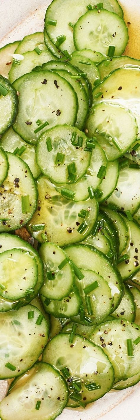 sliced cucumbers are arranged in a dish