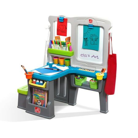 a child's desk and chair with toys on it