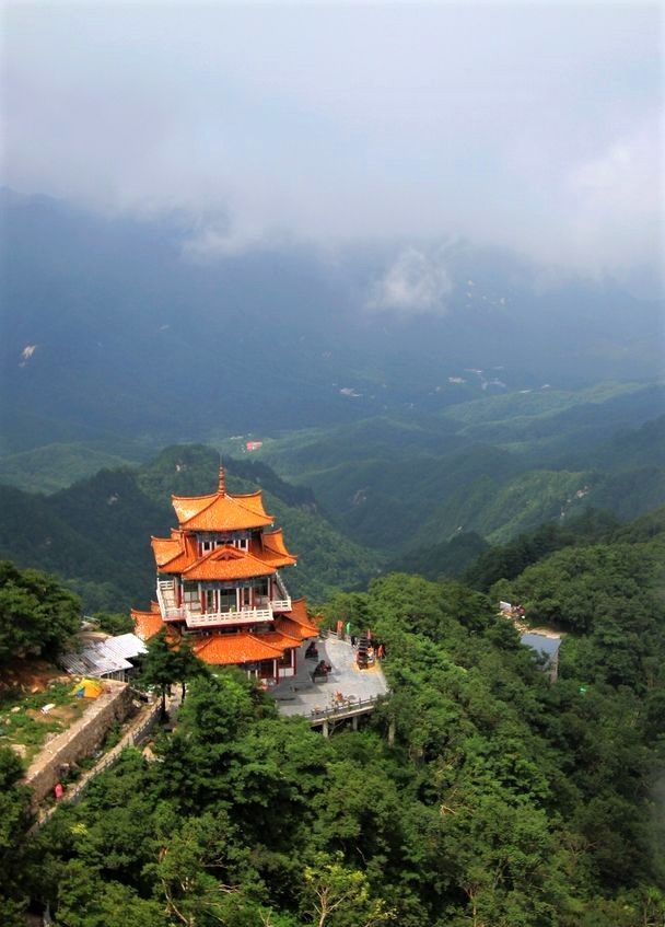 an orange building on top of a mountain