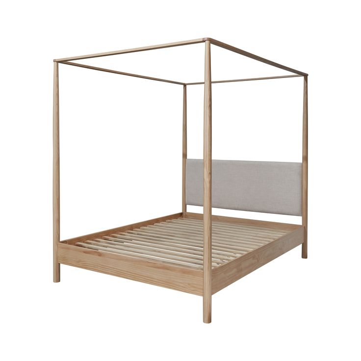 a bed with a metal frame and headboard