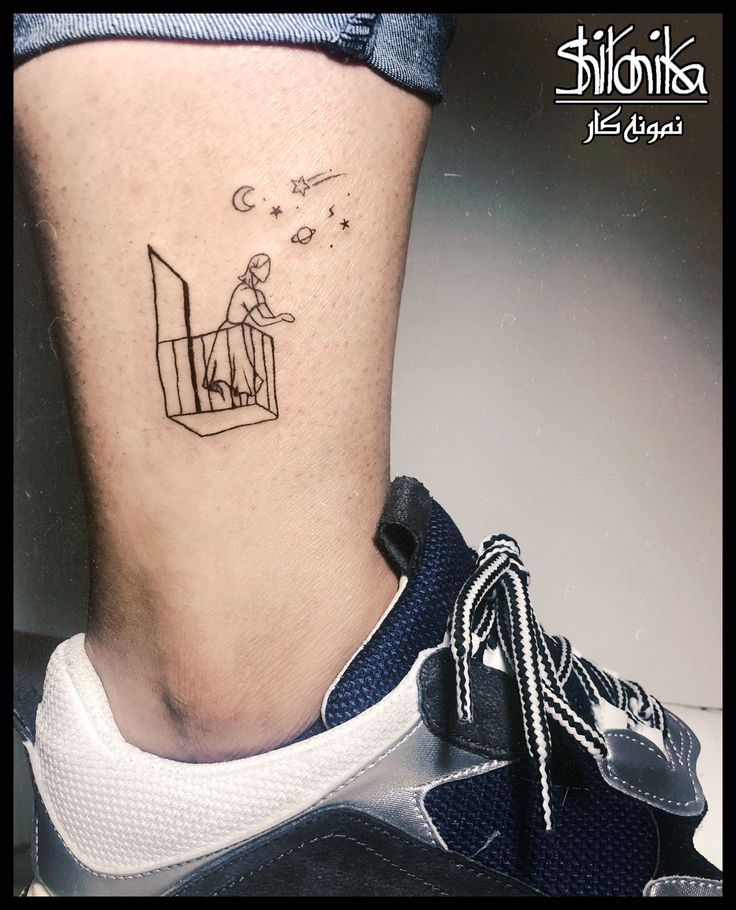 a person with a small tattoo on their leg