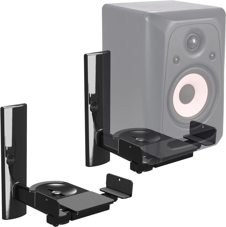 two speakers and one speaker stand are shown