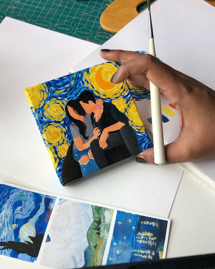 someone is painting the starry night with their hands on top of some art work