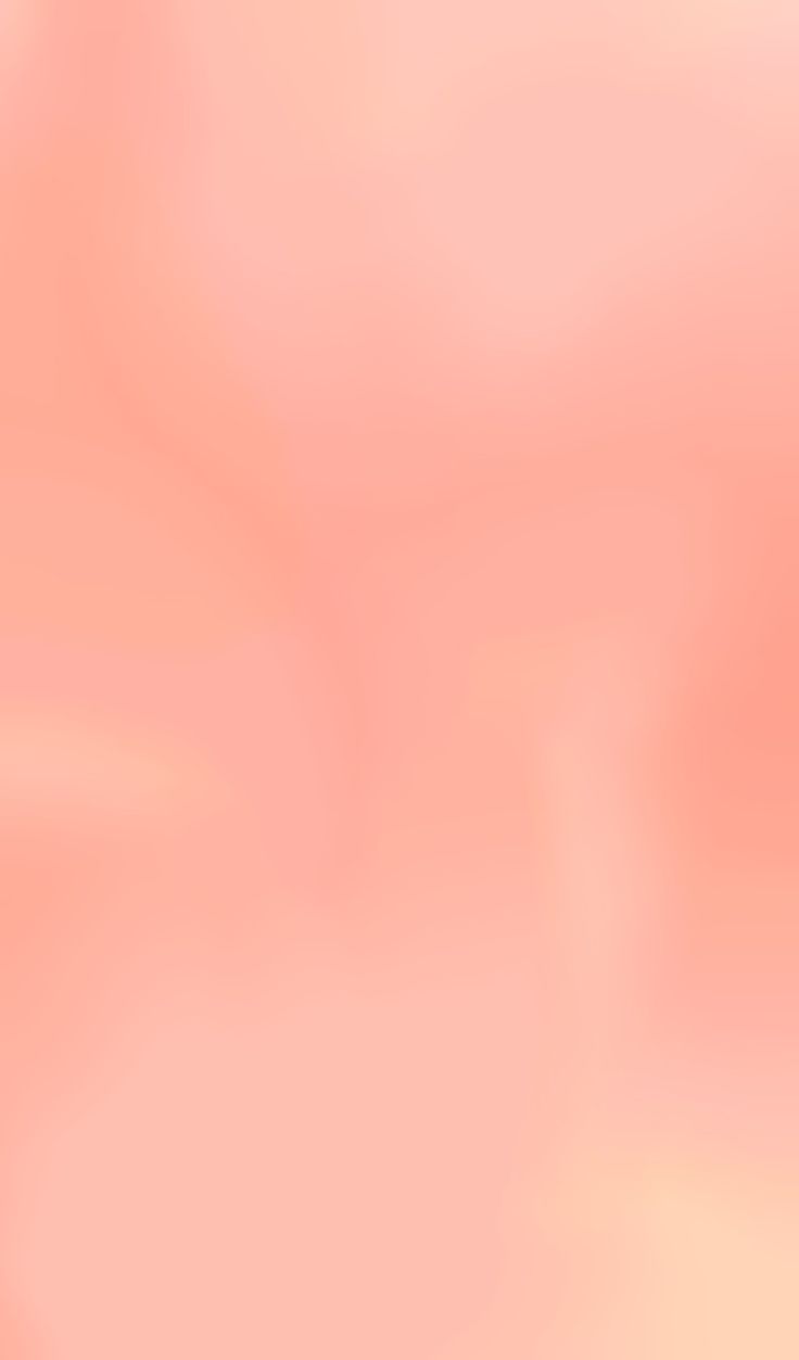 a blurry image of an orange and pink background