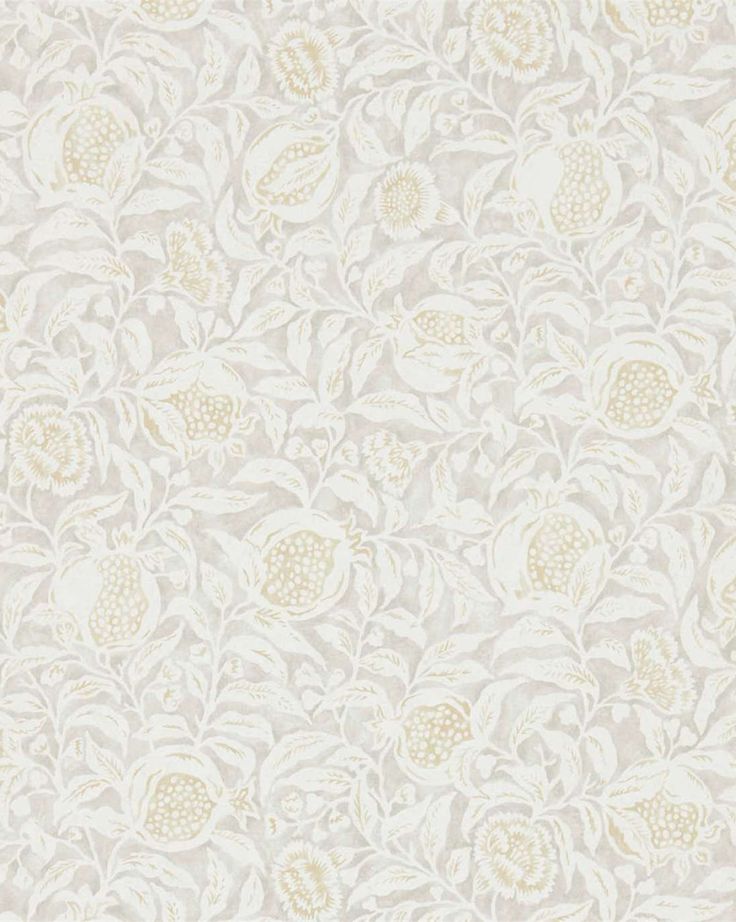 a white and beige wallpaper with flowers on the side, in an ornate pattern