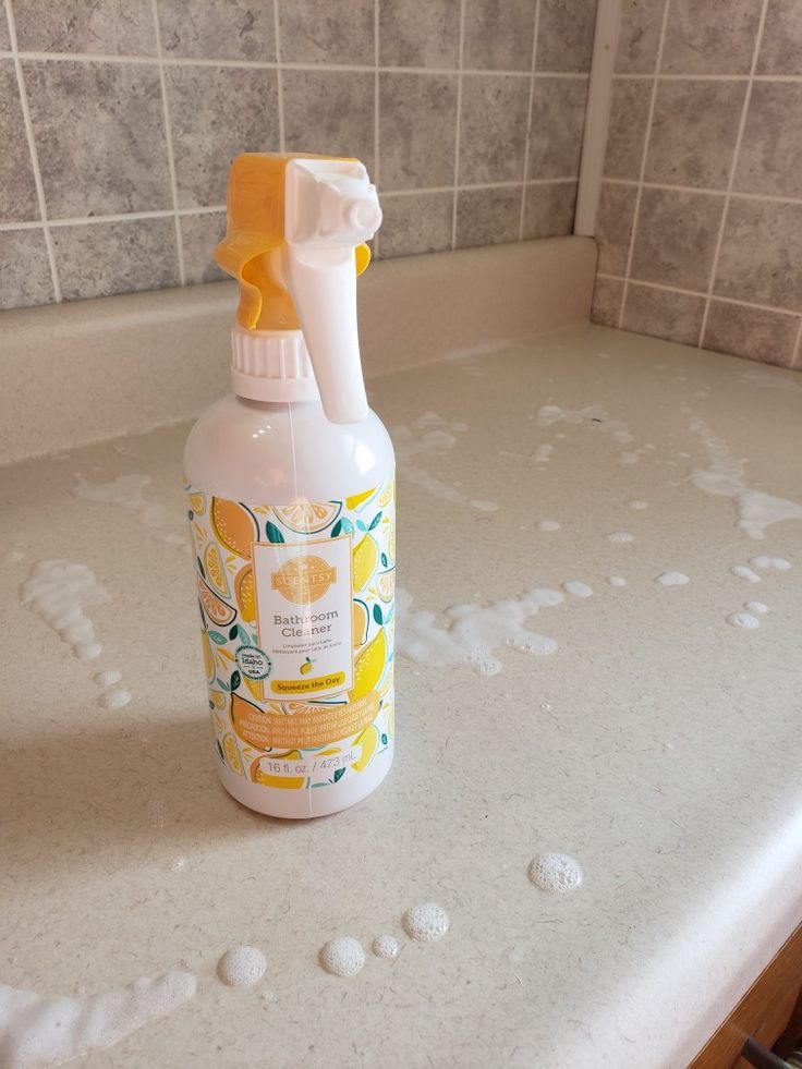 a bottle of hand sanitizer sitting on top of a counter