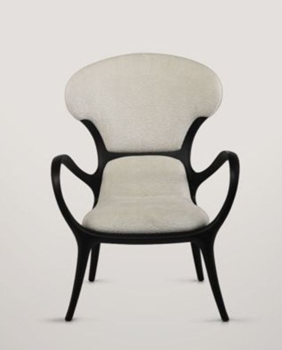 a black and white chair with an upholstered back