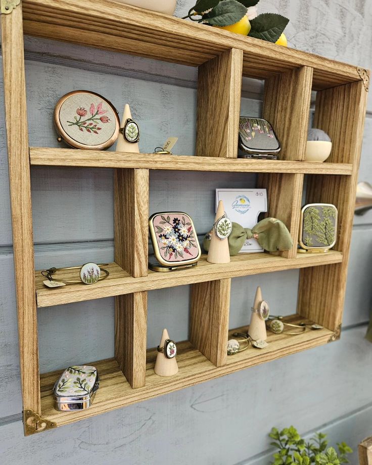 a wooden shelf filled with lots of different items