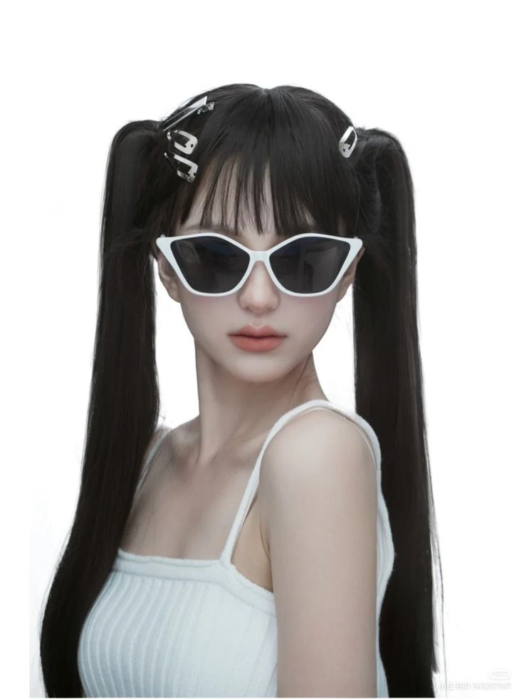 a woman with long black hair wearing sunglasses