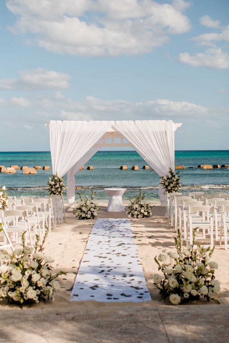 an outdoor wedding setup on the beach