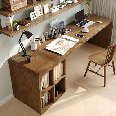 a wooden desk topped with lots of shelves filled with books and office supplies next to a window