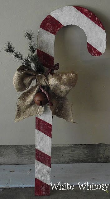 a wooden letter decorated with christmas decorations