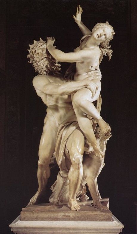 an image of a statue that looks like it is being hugged by another man and woman