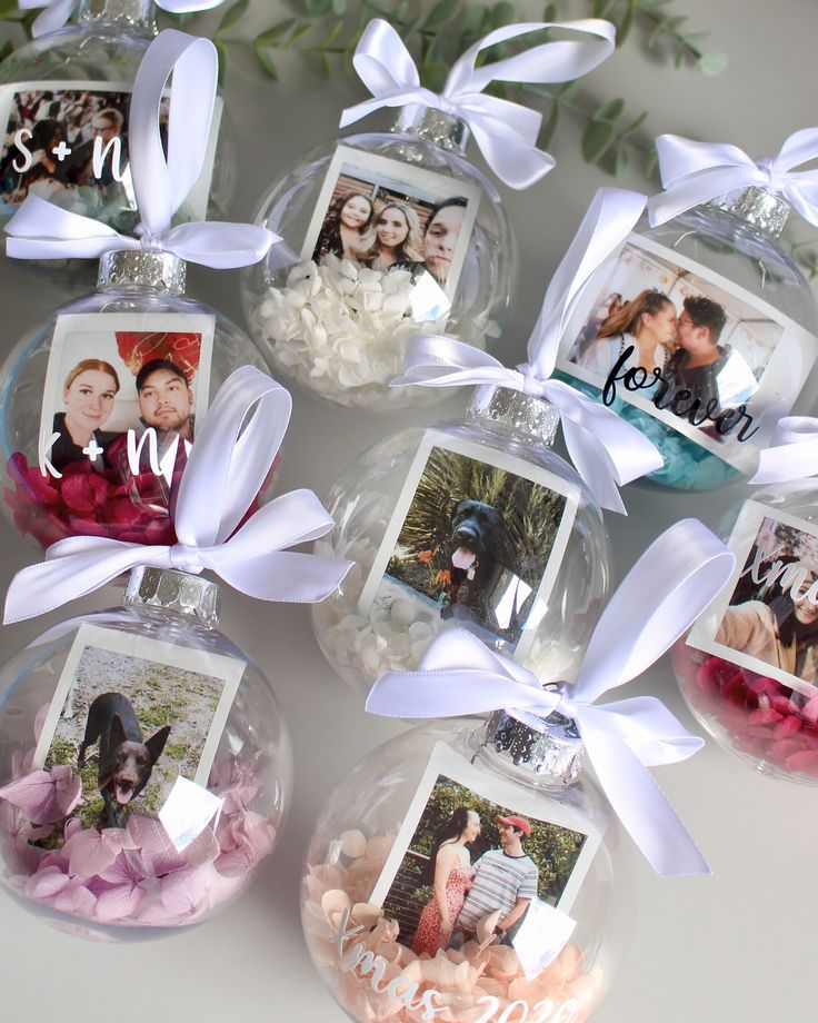 a group of glass ornaments with pictures on them