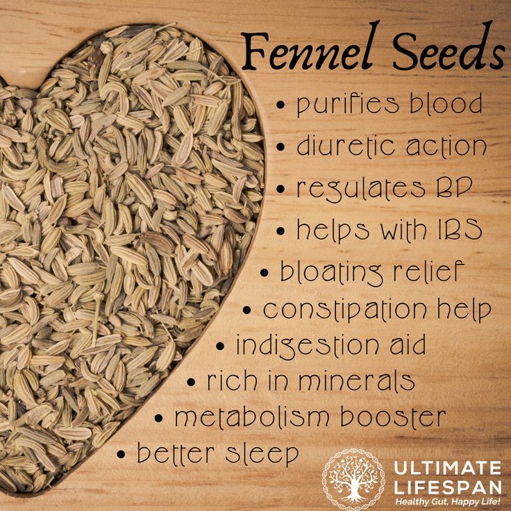 fennel seeds in the shape of a heart on a cutting board with information about its benefits