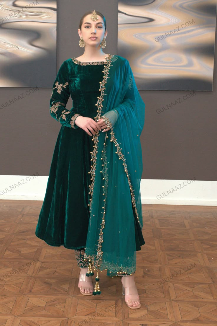 Zafira Green Velvet Anarkali Dress | Shop Now! Velvet Suite Design, Velvet Dress Colors, Walwet Suit Designs, Velvate Dress Design Gown, Velvet Salwar Suit Designs, Bottle Green Dress Outfits, Valvet Suite Design, Winter Wedding Outfits Indian, Green Nikkah Dress