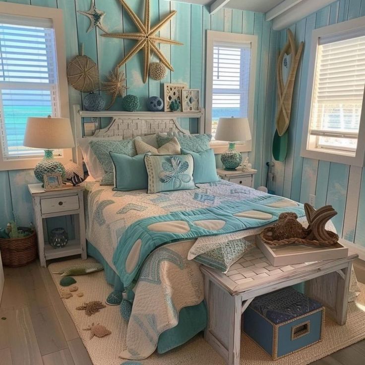 a bedroom decorated in blue and white with starfish decor on the wall above the bed