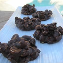 chocolate covered cookies sitting on top of a blue table